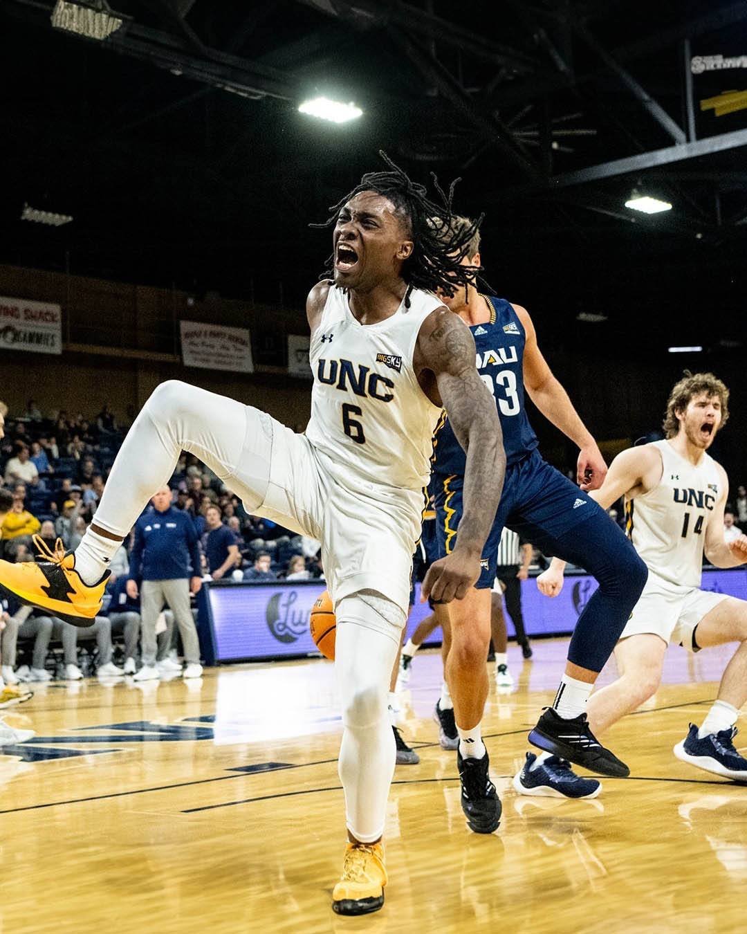 Northern Colorado guard in action during a game, driving to the basket with intensity as he leads the Bears in their Big Sky Conference campaign