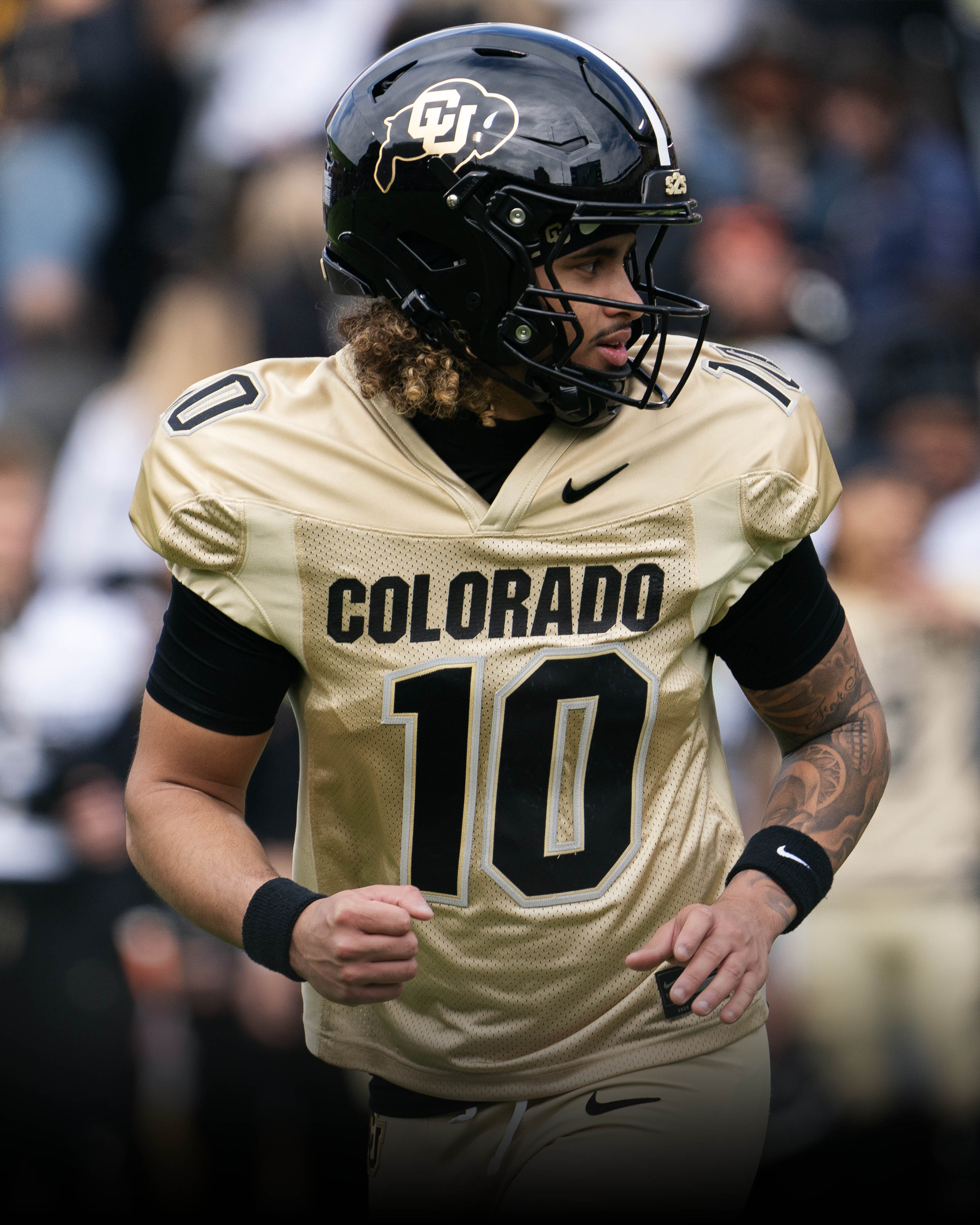 Julian Lewis drops back to pass during Colorado’s 2025 Spring Game at Folsom Field, showcasing poise in the pocket.