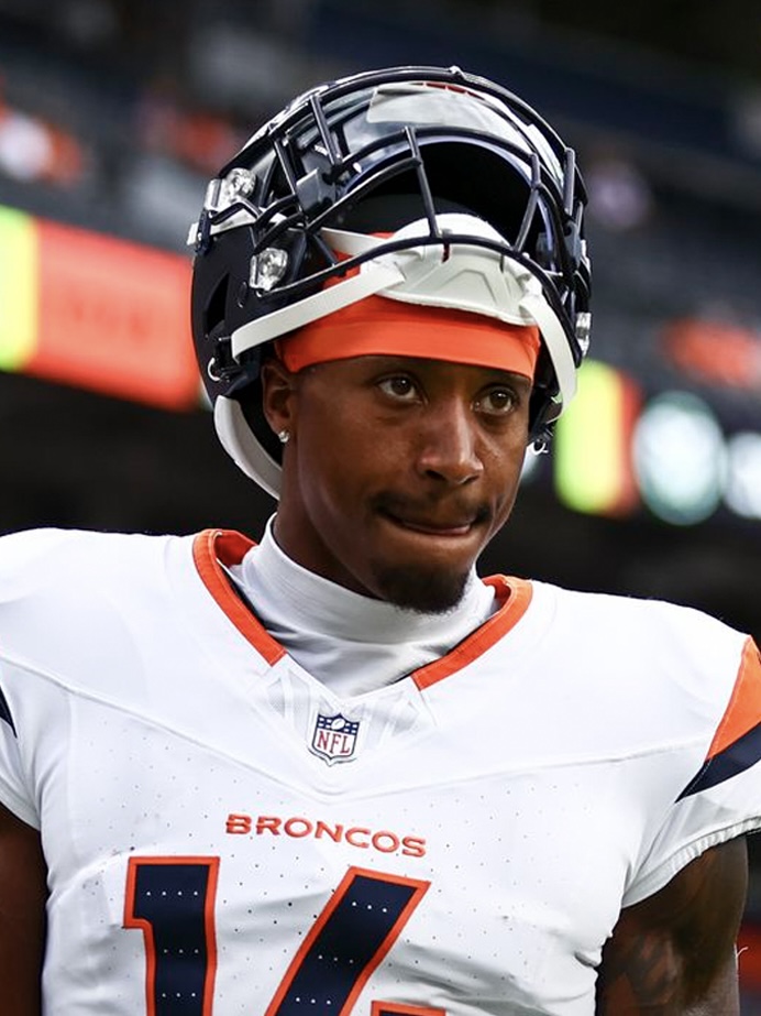 Courtland Sutton smiles at podium after signing contract extension with the Denver Broncos