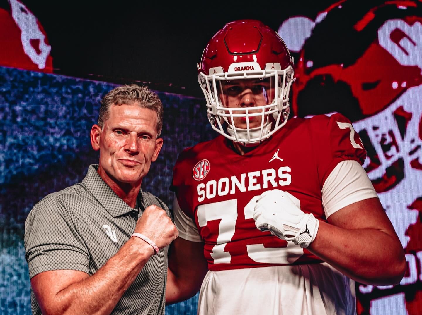 Deacon Schmitt announces his commitment to Oklahoma at Windsor High School, surrounded by family, teammates, and Six Zero Academy founder Matt McChesney