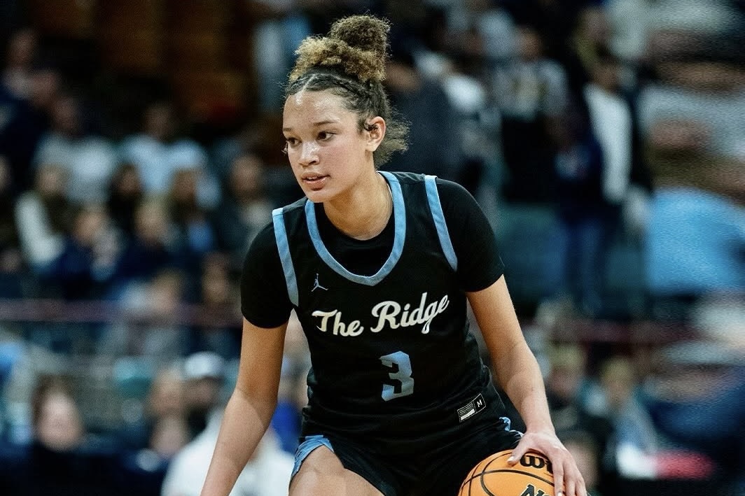 Brihanna Crittendon poses courtside