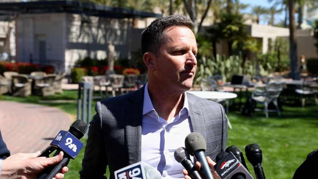 Illustrated Denver Broncos 2026 NFL Draft graphic featuring draft board elements, Broncos colors and article branding focused on Denver’s strategy after the Jaylen Waddle trade.