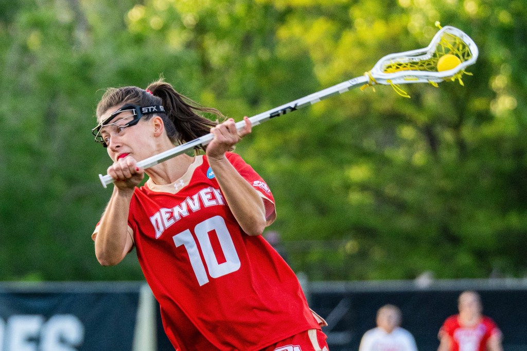Denver women’s lacrosse players celebrate during a 15-8 NCAA Tournament win over Florida at Prentup Field in Boulder.