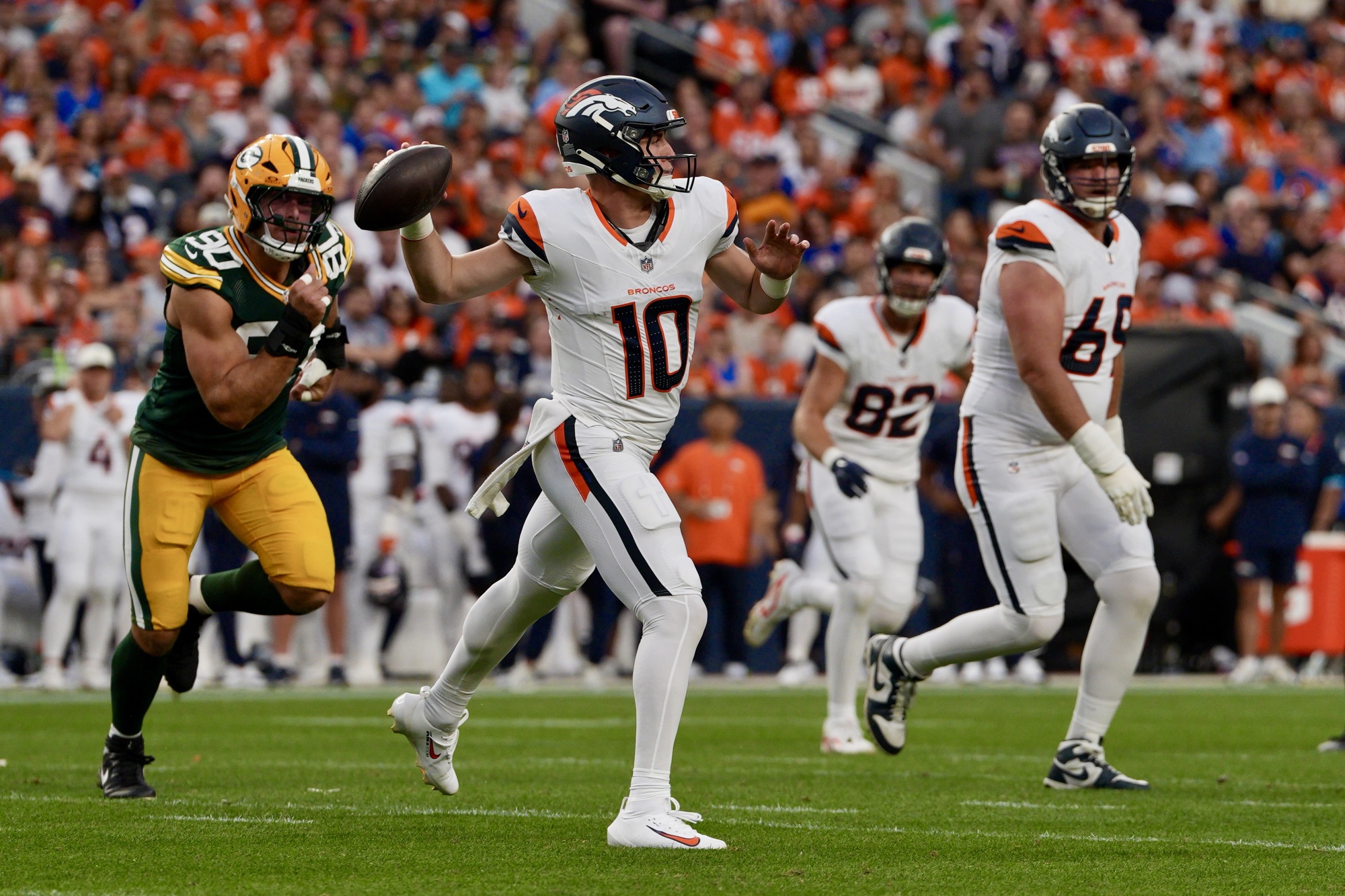 Denver Broncos quarterback Bo Nix throws a pass against the Green Bay Packers in an NFL Preseason game at Empower Field at Mile High in Denver, CO on August 21, 2026. (Photo Carlos Bryant/DSM)